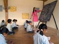A teacher at the blackboard.