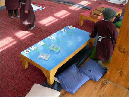 A thorough grounding in arithmetic is a cornerstone of our curriculum: Infant pupils learning using Montessori techniques