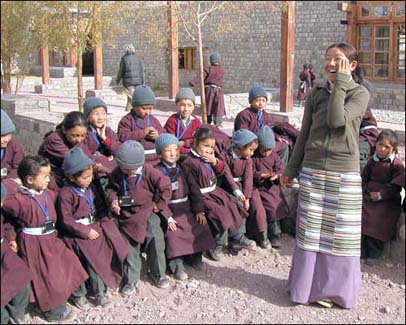 Tenzin Palkyi tutoring Nursery & Infant children for a cultural performance