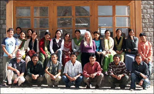 The former Principal and her staff. Maureen Songhurst, centre, with her 18 teachers and many vital support staff