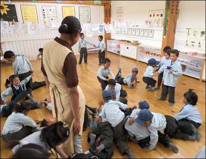Tsering Angmo watches the boys being boys (Lower Kindergarten)