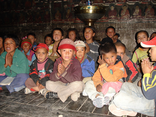 Residential students praying in Shey Palace