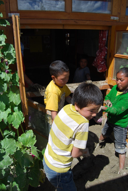 Children clearing a classroom