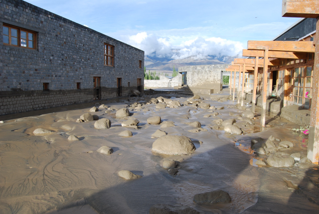 Mud and boulders by Rancho's wall|<b>The full length of the waist height mark left by the mud on Rancho's wall is clearly visible</b>
